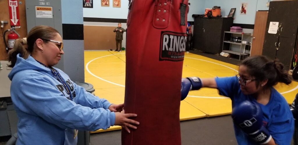 coach and child training for boxing