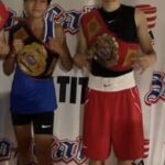 Two Boys With Boxing Gear Holding Belts